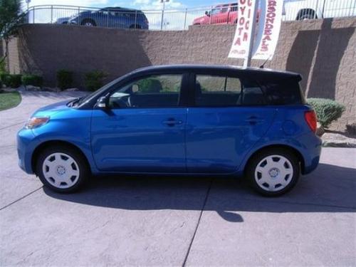 Photo of a 2013 Scion xD in Black Sand Pearl on Blue Streak Metallic (paint color code 2KZ)