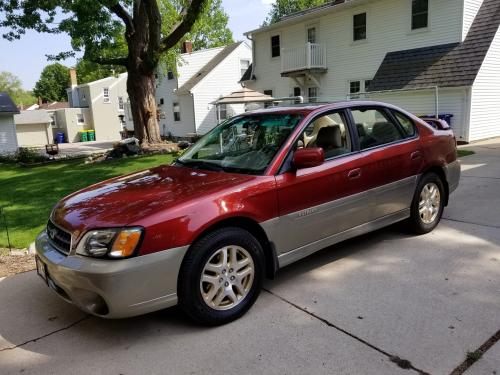 Photo of a 2002-2004 Subaru Legacy in Regatta Red Pearl on Titanium Pearl (paint color code 1Y2)