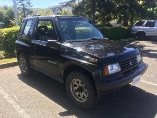 Photo of a 1991-1998 Suzuki Sidekick in Midnight Black Metallic (paint color code 0DG)