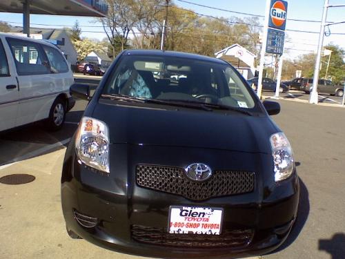 Photo of a 2007-2012 Toyota Yaris in Black Sand Pearl (paint color code 209)